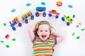 Little girl with wooden train