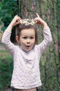 Little girl with a wreath of daisies on her head Royalty Free Stock Photo