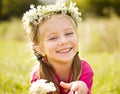 Little girl in wreath of flowers Royalty Free Stock Photo