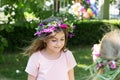 Little girl with wreath of flowers on her head, celebrating Lazarus saturday Royalty Free Stock Photo