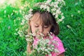 Little girl with a wreath of flowers on her head Royalty Free Stock Photo