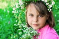 Little girl with a wreath of flowers on her head Royalty Free Stock Photo