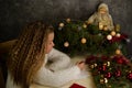 Little girl writes a letter to Santa Claus. Emotions: joy, happiness, thoughtfulness, fatigue ... Christmas should be hurried soon