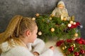 Little girl writes a letter to Santa Claus. Emotions: joy, happiness, thoughtfulness, fatigue ... Christmas should be hurried soon