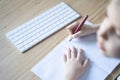 Little girl writing with fountain pen in her notebook Royalty Free Stock Photo