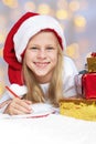 little girl writing a letter to Santa Claus Royalty Free Stock Photo