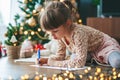 Little girl writing a letter to Santa Claus Royalty Free Stock Photo