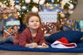 Little girl writing letter to santa. happy kid making a wish, gift, present on new year eve. child dreaming under the christmas Royalty Free Stock Photo