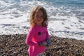 Little girl of 4 years old on a beach of Kithira