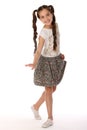 Portrait of a pretty young teenage girl 12 years old in a skirt with bare legs Royalty Free Stock Photo