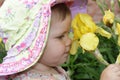 Little girl with yellow flower Royalty Free Stock Photo