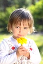 Little girl with yellow flower
