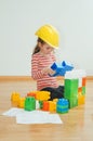 Little girl with yellow hard hat. Royalty Free Stock Photo
