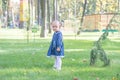 Little girl with yellow leaf. Child playing with autumn golden leaves. Kids play outdoors in the park. Children hiking in fall for Royalty Free Stock Photo