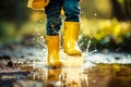 Little girl in yellow rubber boots jumping in puddles in autumn rain. Generative AI