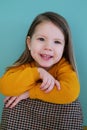 A little girl in a yellow shirt