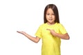 Little girl in yellow t-shirt holding her hand out Royalty Free Stock Photo