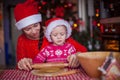 Little girl with young mother baking Christmas Royalty Free Stock Photo