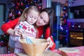 Little girl with young mother baking Christmas Royalty Free Stock Photo