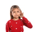 Little girl zipping her mouth. Using sign language Royalty Free Stock Photo