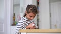 Little GirlChild Home On Sofa Playing With Pet Hamster. Concept of Friendship of children and Animals.