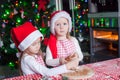 Little girls baking gingerbread cookies for Royalty Free Stock Photo