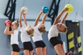 Little girls, beginner gymnastics athletes doing exercises with gymnastics equipment at sports gym, indoors. Concept of Royalty Free Stock Photo