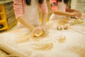 Little girls chefs crumple the dough, funny bakers Royalty Free Stock Photo