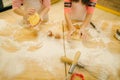 Little girls chefs crumple the dough, funny bakers Royalty Free Stock Photo