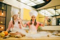 Little girls chefs prepared dough, funny bakers Royalty Free Stock Photo