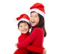 little Girls with christmas hat and Giving Another Hug Royalty Free Stock Photo