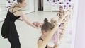 Little girls dance ballet. Children in ballet class. Little ballerinas and teacher. Beautiful view. Royalty Free Stock Photo