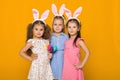 Little girls with Easter bunny ears holding colorful eggs Royalty Free Stock Photo