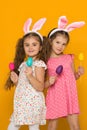 Little girls with Easter bunny ears holding colorful eggs Royalty Free Stock Photo