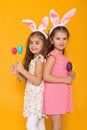 Little girls with Easter bunny ears holding colorful eggs Royalty Free Stock Photo