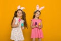 Little girls with Easter bunny ears holding colorful eggs Royalty Free Stock Photo