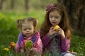 Little girls eat apples