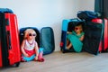 Little girls enjoy packing and travel, family going on vacation Royalty Free Stock Photo