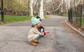 Little girls feeds a squirrel in Central park, New