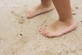 Little girls feet with summer asseccories