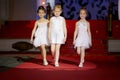 Little girls go on podium during children fashion show Royalty Free Stock Photo