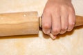 Little girls hand with rolling pin and flour Royalty Free Stock Photo