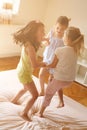 Little girls having fun together in bed. Little girls playing at Royalty Free Stock Photo