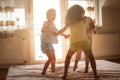 Little girls having fun together in bed. Little girls playing at Royalty Free Stock Photo