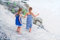 Little girls having fun at tropical beach playing together outdoors Royalty Free Stock Photo