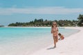 Two little happy girls have a lot of fun at tropical beach playing together Royalty Free Stock Photo