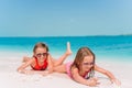 Two little happy girls have a lot of fun at tropical beach playing together Royalty Free Stock Photo