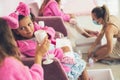 Little girls having part in spa center.