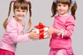 Little girls holding gift boxes Royalty Free Stock Photo