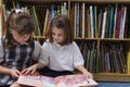 Little Girls Looking At A Picture Book